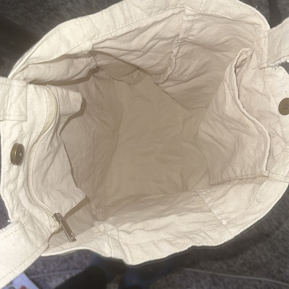 Public Goods Canvas Tote bag. Has 2 inner pockets one zippered, & bottle pocket. - Picture 3 of 4